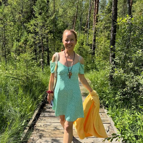 Irina Varlamova on a forest path in summer