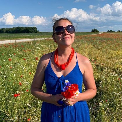 Irina Varlamova in a poppy field